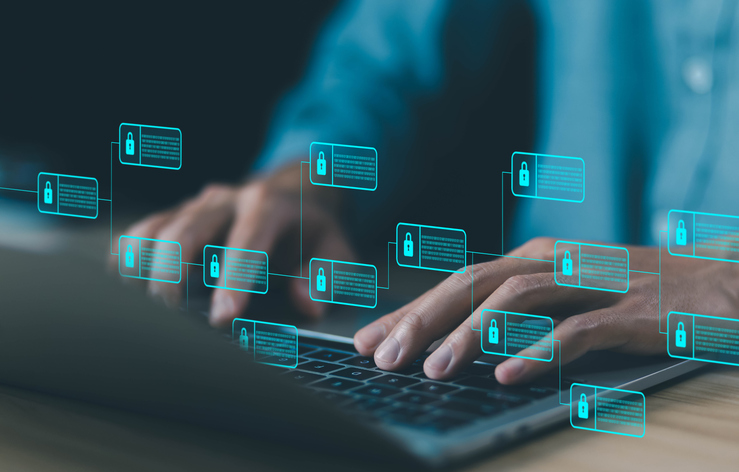 Typing on laptop with digital data and padlock card graphics